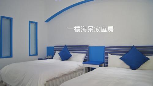 Postel nebo postele na pokoji v ubytování 南灣飯店 Kenting Nanwan Hotel