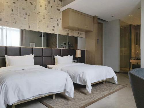 Cama o camas de una habitación en Time Tunnel Designer Hotel Xi'an