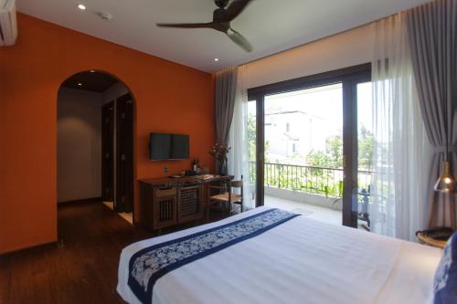 Ένα ή περισσότερα κρεβάτια σε δωμάτιο στο Ocean Breeze Villa