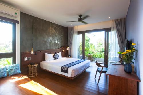 Ένα ή περισσότερα κρεβάτια σε δωμάτιο στο Ocean Breeze Villa
