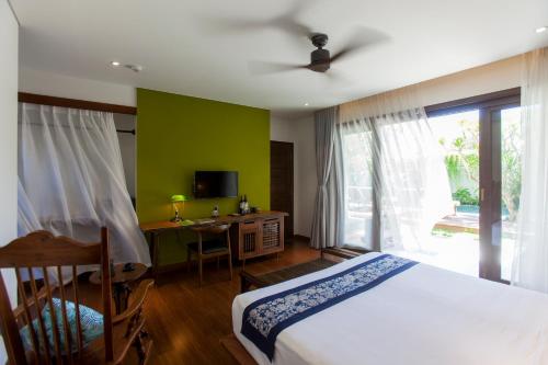 Ένα ή περισσότερα κρεβάτια σε δωμάτιο στο Ocean Breeze Villa