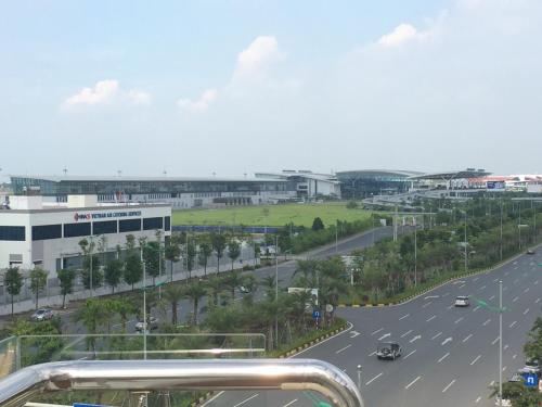 a view of a street with cars on the road at HD House in Noi Bai