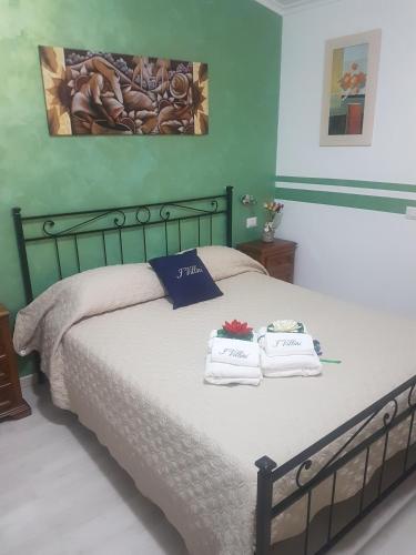 Ένα ή περισσότερα κρεβάτια σε δωμάτιο στο I Villini Affittacamere