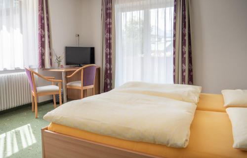 Postel nebo postele na pokoji v ubytování Pension Gstrein