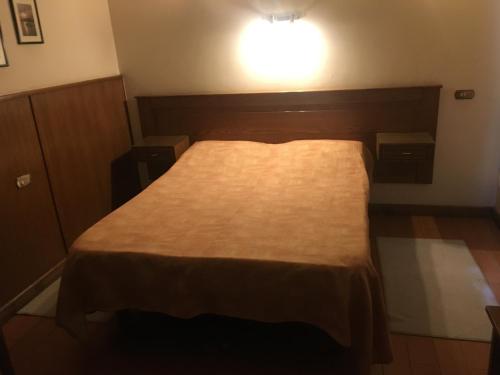 Кровать или кровати в номере Pension Roma