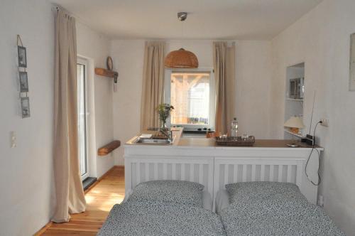 a living room with a couch and a window at Pension (FW) "Seeblick" am Stelzenhaus in Dornburg