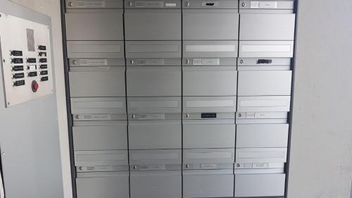 a stack of glass cabinets in a room at Stopoase in Bern