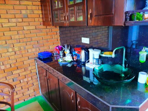a cluttered kitchen counter with a messy counter top at Leisure Villa in Colombo
