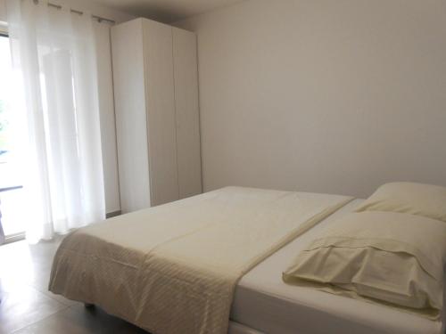 Ένα ή περισσότερα κρεβάτια σε δωμάτιο στο Villa Ivana