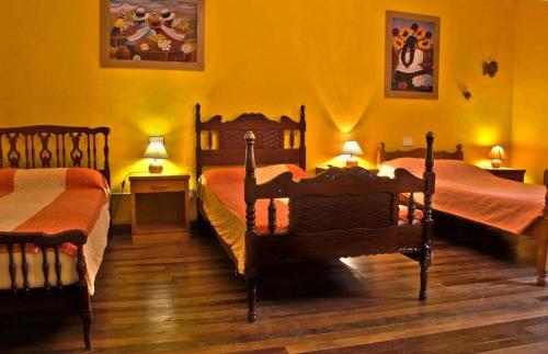 En eller flere senge i et værelse på Hostel Tenerife