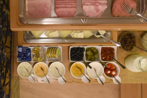 a drawer filled with lots of different types of food at Hotel Krone 1512 in Salzburg