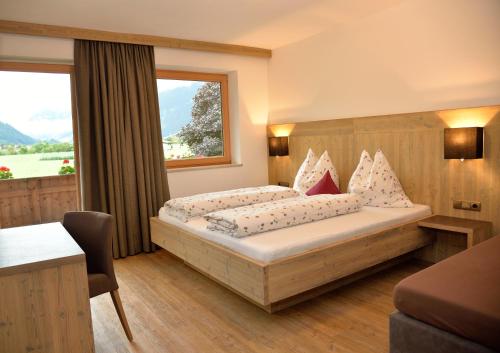 מיטה או מיטות בחדר ב-Klausnerhof