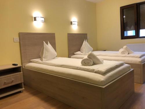 Säng eller sängar i ett rum på Vila Toscana