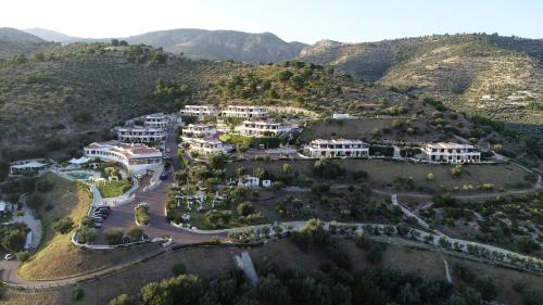 an aerial view of a mansion on a mountain at Holiday Lodge al Porto in Mattinata