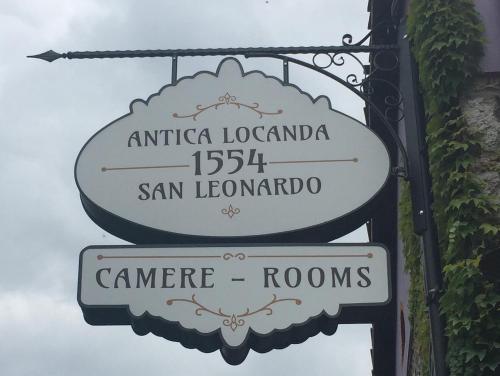 a sign for a street sign for san lorenzo at Antica Locanda San Leonardo 1554 in Ghivizzano