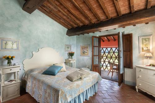 1 dormitorio con 1 cama en una habitación en La Capannina di Matteo, en Tavarnelle in Val di Pesa