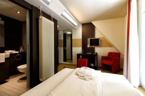 Ένα ή περισσότερα κρεβάτια σε δωμάτιο στο Santé Royale Hotel- & Gesundheitsresort Bad Brambach