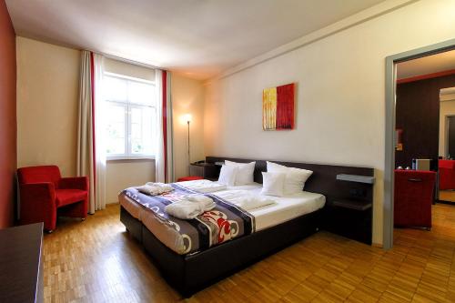 Postel nebo postele na pokoji v ubytování Santé Royale Hotel- & Gesundheitsresort Bad Brambach