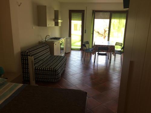 a kitchen and living room with a table and chairs at Le Villette in Pescara