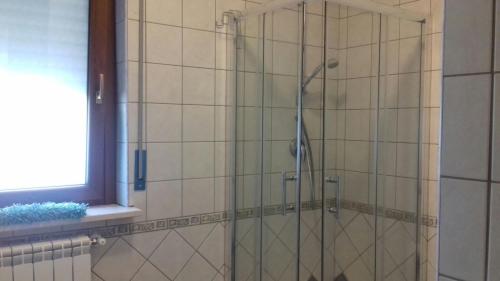 a shower with a glass door in a bathroom at Le Villette in Pescara