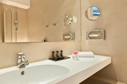 Salle de bains dans l'établissement Hotel Maxim