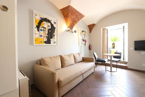 a living room with a couch and a table at Light Blue Apartments - Downtown Lisbon in Lisbon