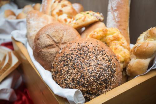 a box filled with lots of different types of bread at Ascott Palace Dhaka in Dhaka