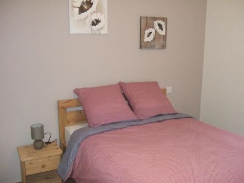 Ein Bett oder Betten in einem Zimmer der Unterkunft Gite Les Gobelins