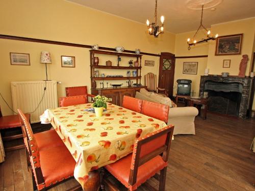 a dining room with a table and a living room at Quaint Holiday Home in Bouillon Ardennes in Bouillon