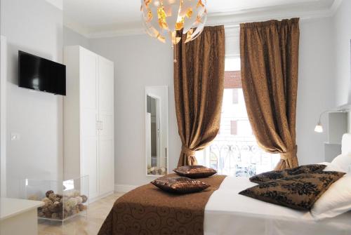 a bedroom with a bed and a large window at Residenza Vatican Suite in Rome