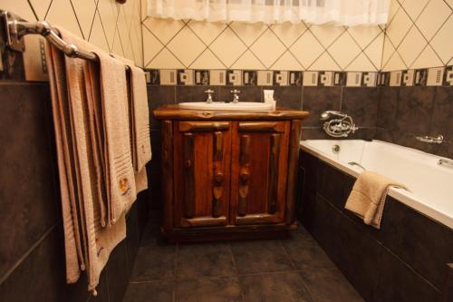 Vonios kambarys apgyvendinimo įstaigoje Swadini, A Forever Resort