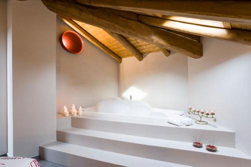 a room with white stairs and a wooden ceiling at Casa Vacanza Etna Dream in Zafferana Etnea
