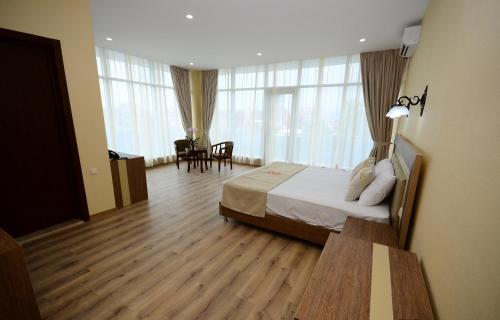 Postel nebo postele na pokoji v ubytování Hotel 725 B