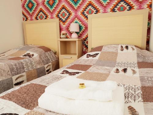 Ένα ή περισσότερα κρεβάτια σε δωμάτιο στο Vagabond Apartman