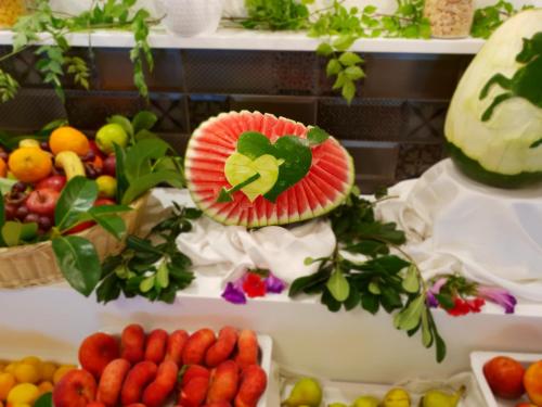 a display of fruits and vegetables on a table at Elea Beach Hotel in Dassia
