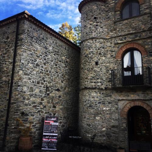 an old brick building with a window and a balcony at Hotel Ristorante Mulino Iannarelli in San Severino Lucano