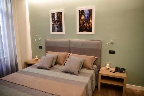 Un pat sau paturi într-o cameră la 50 SUITE Relais&Relax