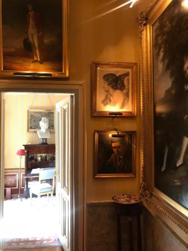 a room with paintings on the wall and a doorway at Park Mansion Centre in Amsterdam