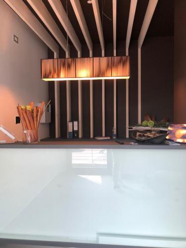 a kitchen with a counter top with a light at Ex-L in Fiume Veneto