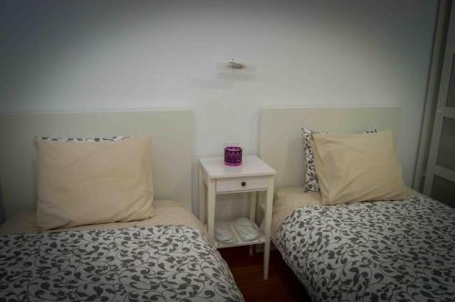 Postel nebo postele na pokoji v ubytování Casinha da Calçada