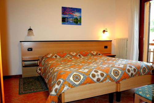 Rúm í herbergi á albergo ristorante le fontane