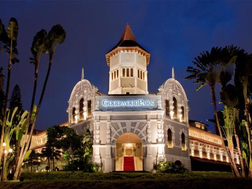 a building with a clock tower at night at Goodwood Park Hotel in Singapore