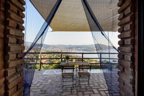 a table and chairs on a balcony with a view at Maelka Belvedere in Agropoli