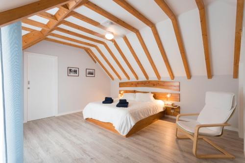 
A bed or beds in a room at The Grove l Ericeira Residences
