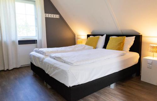 Posteľ alebo postele v izbe v ubytovaní De Brittenburg met privé hottub & sauna 4-persoons