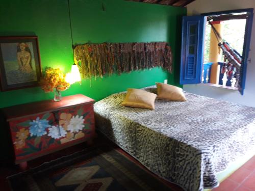 A bed or beds in a room at Casa Jasmine Taíba
