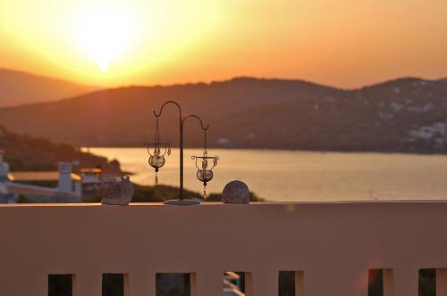 a view of the sunset from the roof of a building at Villa Serenity in Porto Rafti