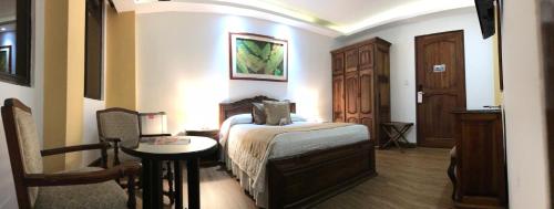 Cama o camas de una habitación en El Gran Hotel de Pereira