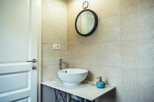 a bathroom with a sink and a mirror on the wall at Luxury Villa Borak in Imotski