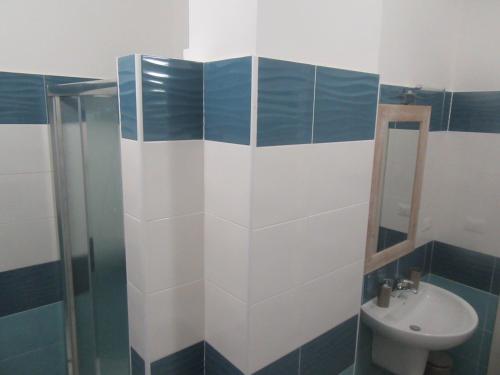 a bathroom with a sink and a toilet at Il Sogno di Calipso in Amendolara
